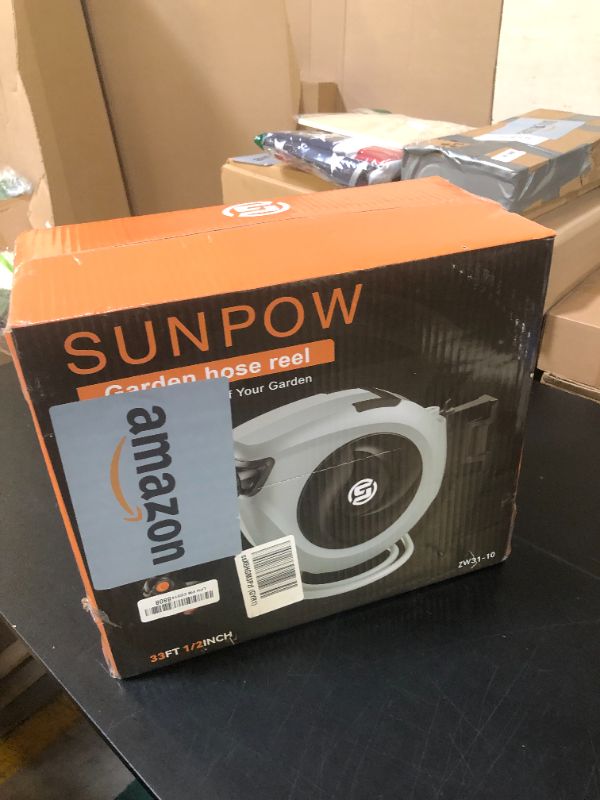 Photo 1 of SUNPOW Retractable Garden Hose Reel 1/2 Inch x 33ft - Wall Mounted Hose Reel with 3/4 Inch Brass Fittings & 10-Pattern Nozzle - Auto Rewind System, Any Length Lock, 180° Swivel Bracket