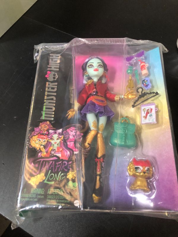 Photo 1 of Monster High Jinafire Long Doll, Dragon with Pet Dog Cloudy “Yun Yun” and 7 Accessories Like Sketch Pad, Yogurt Drink, Backpack and More