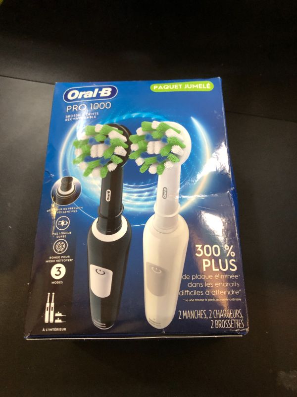 Photo 1 of Oral-B Pro 1000 CrossAction Electric Toothbrush, Black and White, 2 Count