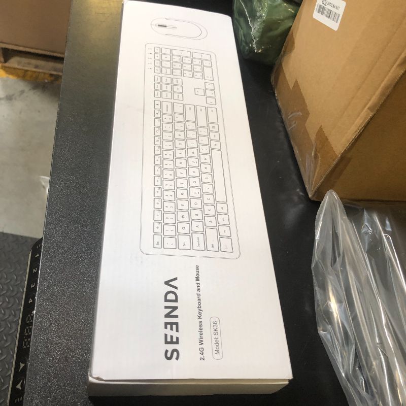 Photo 1 of Wireless Keyboard and Mouse Combo - Full Size Slim Thin Wireless Keyboard Mouse with Numeric Keypad 2.4G Stable Connection Adjustable DPI (White & Silver)