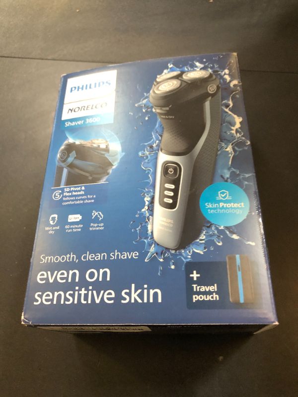Photo 1 of Philips Norelco Shaver 3600 Series, Wet and Dry Electric Shaver, P-Cap, Travel Pouch, Storm Blue, Model S3243/91