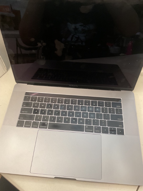 Photo 1 of 2017 Apple MacBook Pro with 3.1GHz Intel Core i7 (15-inch, 16GB RAM, 1TB Storage) Space Gray (Renewed)