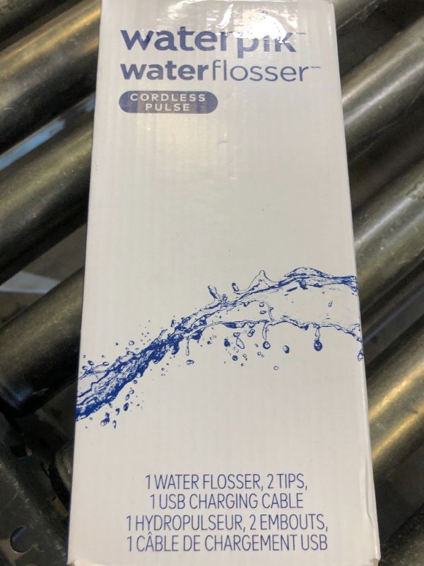 Photo 1 of Waterpik Cordless Pulse Rechargeable Portable Water Flosser for Teeth, Gums, Braces Care and Travel with 2 Flossing Tips, Waterproof, ADA Accepted, WF-20 White, Packaging May Vary