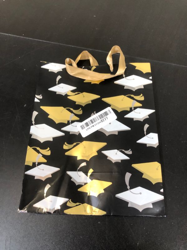 Photo 1 of Hallmark 9" Medium Graduation Gift Bag with Tissue Paper (Gold and Silver Mortarboards on Black) for College, High School, 8th Grade, Kindergarten, Nurses