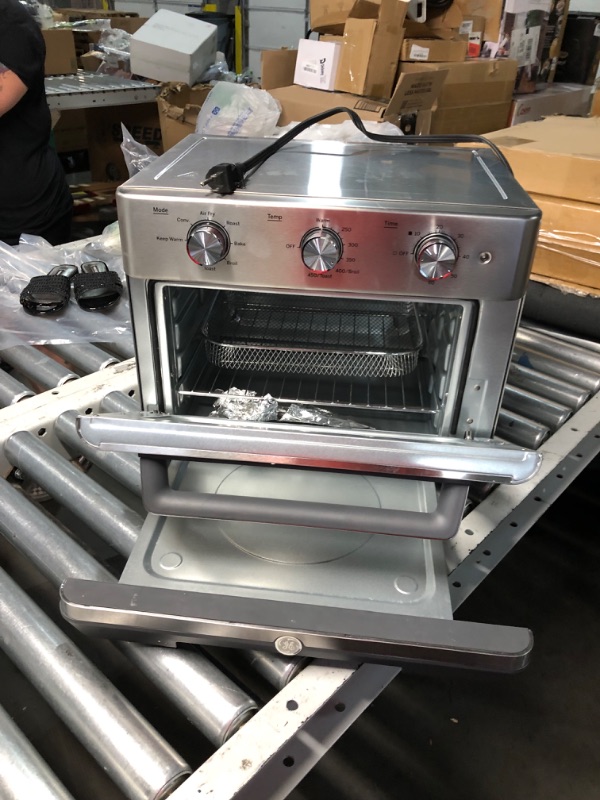 Photo 1 of ***Minor DAMAGE - SEE COMMENTS***
GE Mechanical Air Fryer Toaster Oven + Accessory Set | Convection Toaster with 7 Cook Modes | Large Capacity Oven - Fits 12" Pizza | Countertop Kitchen Essentials | Stainless Steel