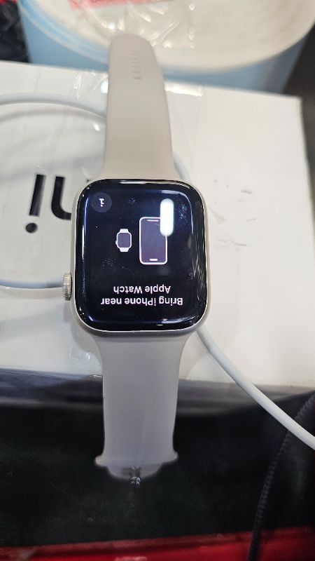 Photo 1 of Apple Watch Series 9 [GPS, 45mm] - Starlight Aluminum Case with Starlight Sport Band, M/L (Renewed Premium)