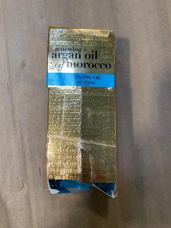 Photo 1 of **DAMAGE TO THE BOX** OGX Renewing + Argan Oil of Morocco, Penetrating Hair Oil Treatment, Moisturizing & Strengthening Silky Oil for All Hair Types, Formulated without Parabens & Sulfated Surfactants, 3.3 Fl Oz