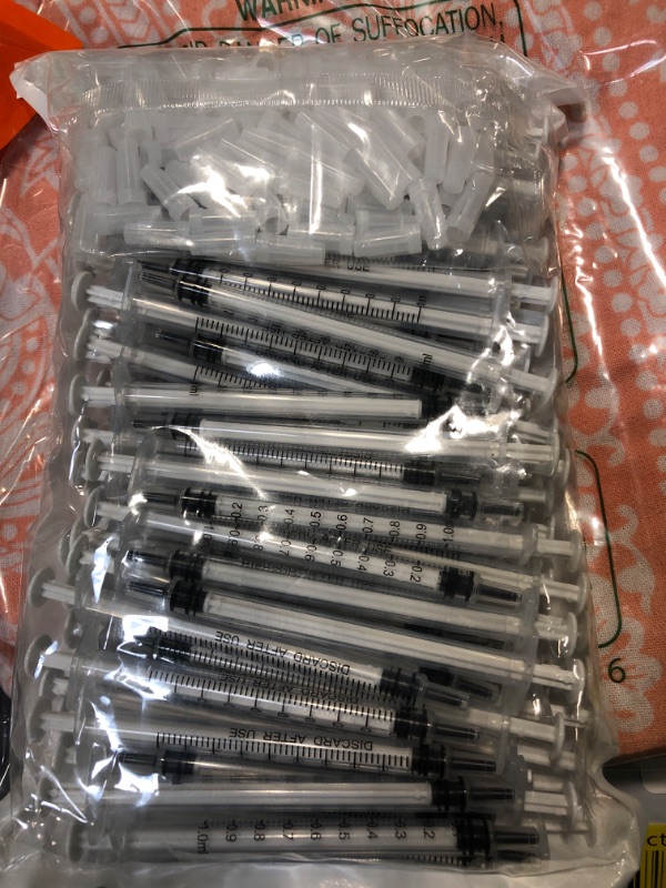 Photo 1 of 100 Pack 1ml Syringe with Cap for Liquid, 1cc Plastic Small Syringes with Cover, Non-Sterile, No Needle