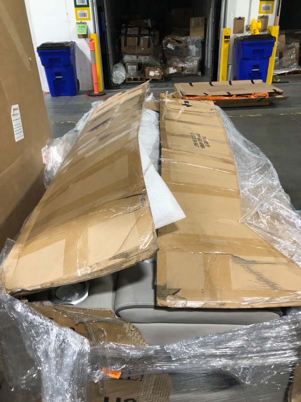 Photo 1 of * Will need a truck for pickup * Signature Design by Ashley Boyington Contemporary Leather Match Power Reclining Sofa with USB Charging Ports, LED Lights and Adjustable Headrest, Light Gray * Has a small smudge mark on armrest*
