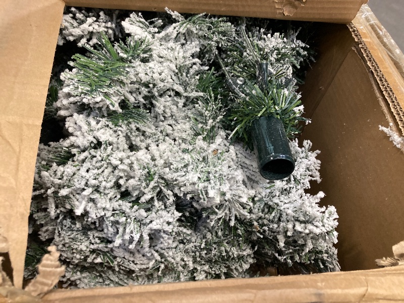Photo 1 of Ifanze 6.5ft Pre-lit Snow Flocked Christmas Tree with 300 Warm Lights 1200 Tips Artificial Snowy Xmas Pine Tree with Reinforced Metal Base for Home O
