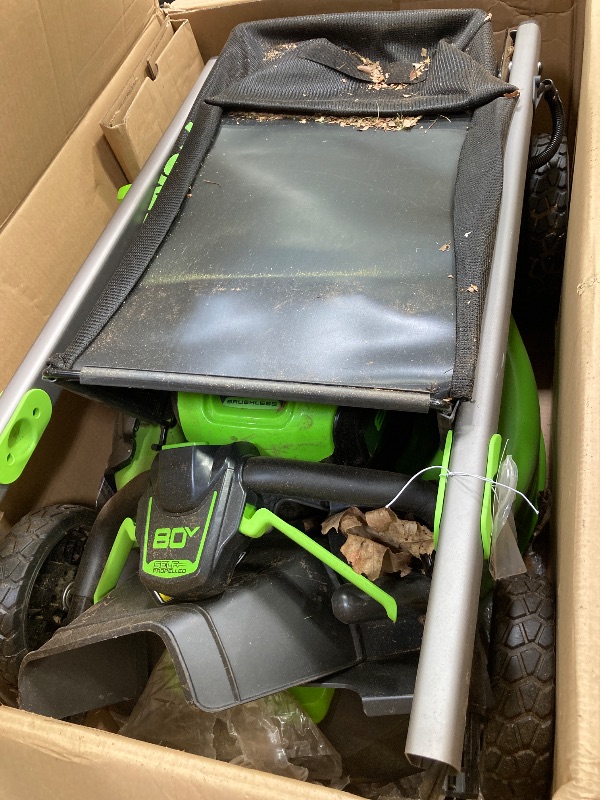 Photo 1 of +++it's stained++++Greenworks 80V 21" Brushless Cordless (Self-Propelled) Lawn Mower (LED Headlight + Aluminum Handles), 4.0Ah Battery and Rapid Charger Included (75+ Compatible Tools)