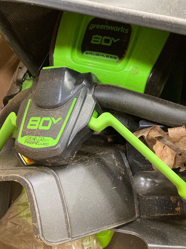 Photo 1 of +++it's stained++++Greenworks 80V 21" Brushless Cordless (Self-Propelled) Lawn Mower (LED Headlight + Aluminum Handles), 4.0Ah Battery and Rapid Charger Included (75+ Compatible Tools)