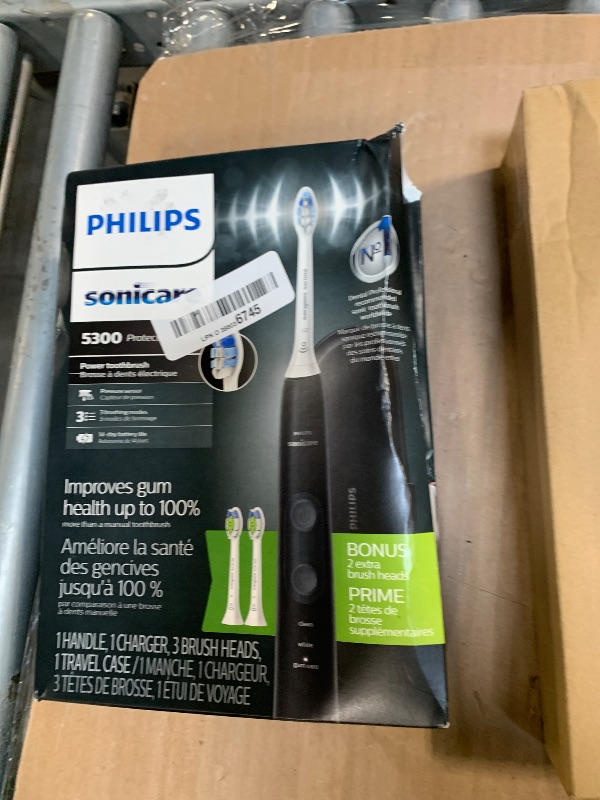 Photo 1 of Philips Sonicare ProtectiveClean 5300 Rechargeable Electric Toothbrush, with Pressure Sensor, 3 Cleaning Modes, SmarTimer and QuadPacer, with 2 Bonus Brush Heads, Travel Case, Black, Model HX6423/34