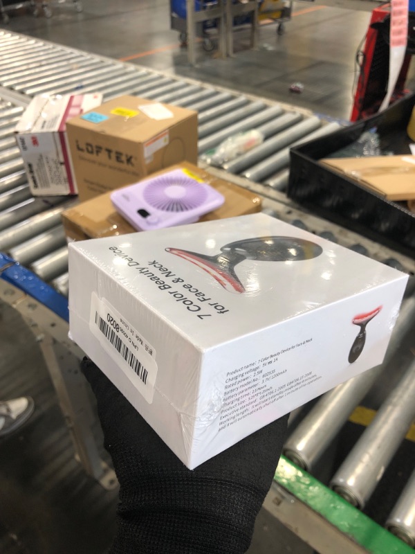 Photo 1 of ** SEALED**
ELISHINE Red-Light-Therapy-for-Face and Neck, 7 Color Light Based Facial Massager, Portable Skin Care Tool (Black)