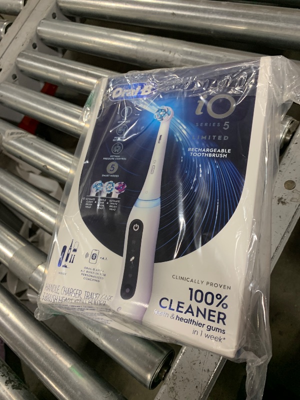 Photo 1 of Oral-B iO Deep Clean + Whiten Rechargeable Electric Toothbrush with Visible Pressure Sensor, 2 Minute Timer, 5 Cleaning Settings, 1 iO5 Limited, 3 Toothbrush Heads, Travel Case & Refill Holder, White