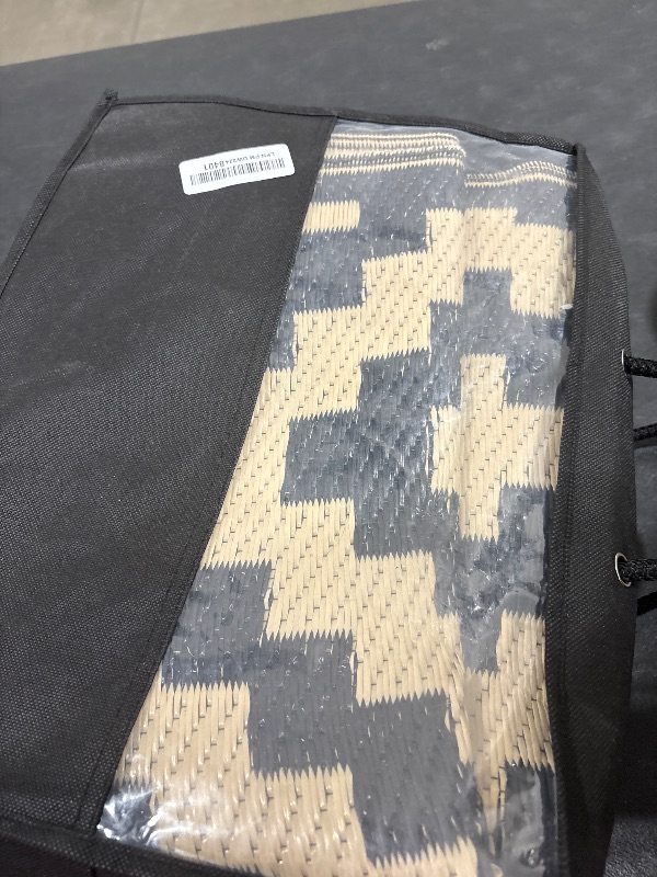 Photo 1 of Smiry Waterproof Outdoor Rug 5x8 ft, Reversible Plastic Straw Patio Camping Rugs, Outdoor Indoor RV Mat Carpet for Patio, Outside Entry, Backyard, Deck, Bench, Picnic, Camper, Black & Beige