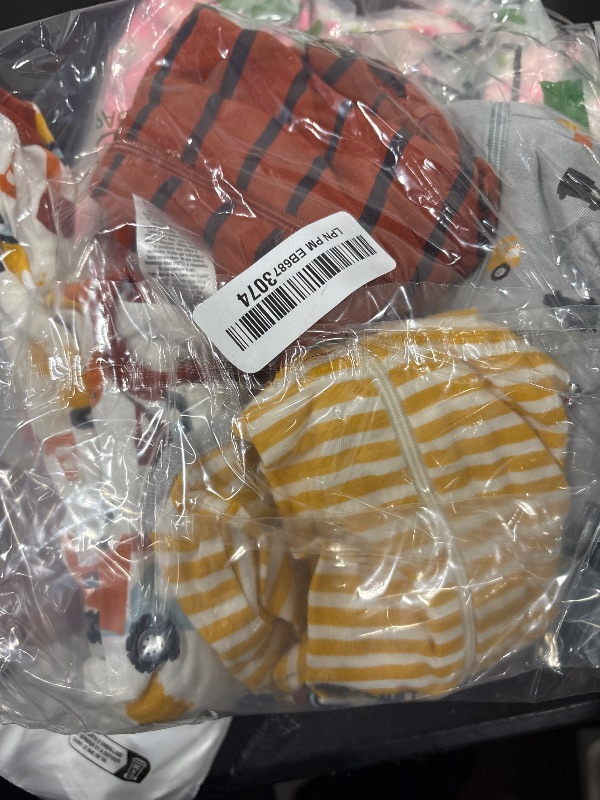 Photo 1 of Gerber Baby Boy's 4 Pack Sleep 'N Play Footie, Transportation Zone, Newborn