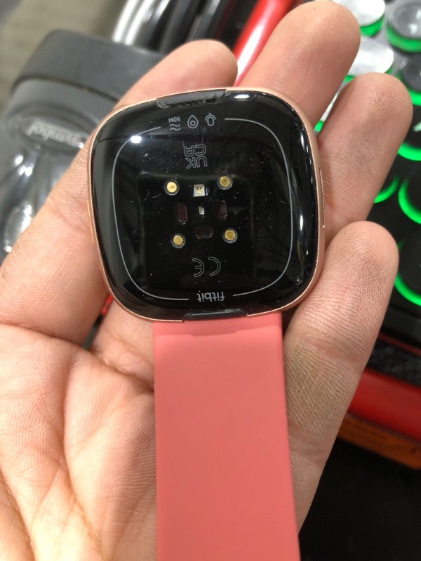 Photo 1 of Fitbit Versa 4 Fitness Smartwatch with Daily Readiness, GPS, 24/7 Heart Rate, 40+ Exercise Modes, Sleep Tracking and More, Pink Sand/Copper Rose, One Size (S & L Bands Included) (Renewed)