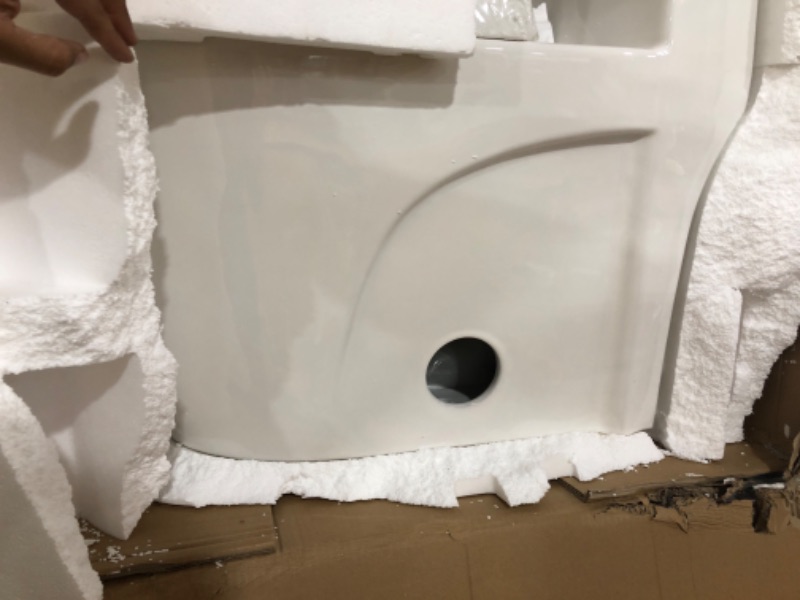 Photo 1 of Swiss Madison St. Tropez SM-1T254HB One-Piece Elongated Toilet Vortex Dual-Flush 1.1/1.6 gpf with Comfort Chair Seat ADA Height in Glossy White with Black Hardware