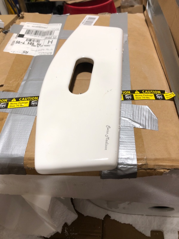 Photo 1 of Swiss Madison St. Tropez SM-1T254HB One-Piece Elongated Toilet Vortex Dual-Flush 1.1/1.6 gpf with Comfort Chair Seat ADA Height in Glossy White with Black Hardware