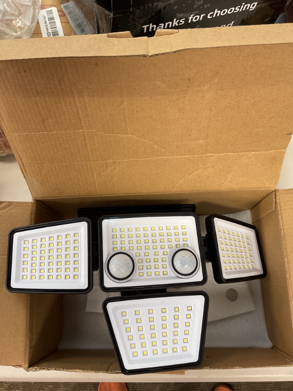 Photo 1 of LYWALT Solar Outdoor Lights - 3000LM 188 LED Motion Sensor Outdoor Lights, 4 Heads Security Light,IP65 Waterproof, Easy Install,270°Wide Angle Flood Wall Light with 3 Modes for Backyard Yard 