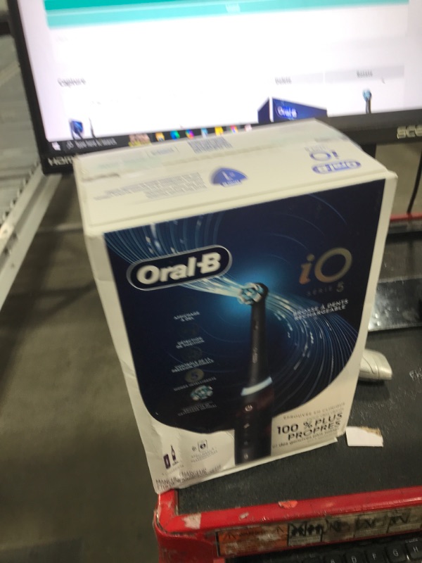 Photo 1 of Oral-B iO Series 5 Rechargeable Electric Toothbrush with Visible Pressure Sensor to Protect Gums, 2 Minute Timer, 5 Cleaning Settings, 1 Replacement Toothbrush Heads, and Travel Case, Black