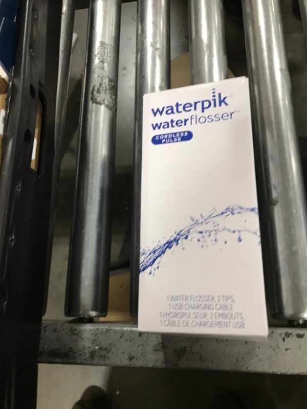 Photo 1 of Waterpik Cordless Pulse Rechargeable Portable Water Flosser for Teeth, Gums, Braces Care and Travel with 2 Flossing Tips, Waterproof, ADA Accepted, WF-20 White, Packaging May Vary