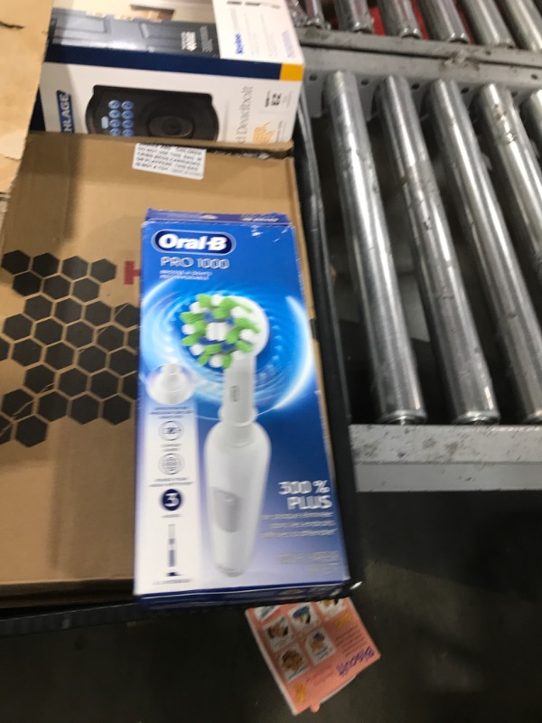 Photo 1 of Oral-B Pro 1000 Rechargeable Electric Toothbrush, White