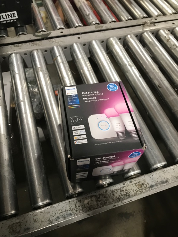 Photo 1 of Philips Hue Smart Light Starter Kit - Includes (1) Bridge and (2) 60W A19 LED Bulb, White and Color Ambiance Color-Changing Light, 800LM, E26 - Control with App or Voice Assistant