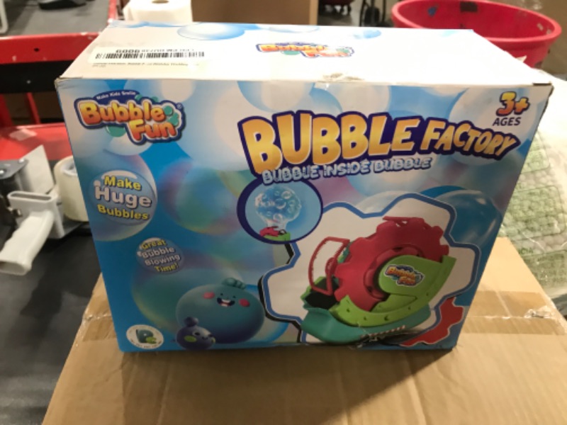 Photo 1 of Bubble Machine for Toddlers Kids, Blower With 8oz Solution, Make Extra Large & Bubbles in Bubble, Maker Toy for Indoor Outdoor Birthday Party
