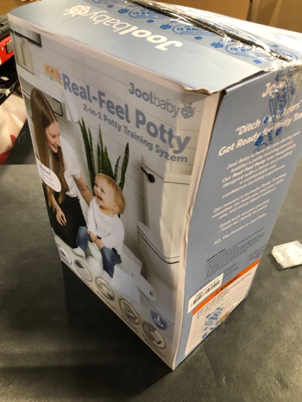 Photo 1 of Real Feel 2-in-1 Potty with Wipes Storage, Flushing Sounds & Disposable Liners - Realistic Toilet - Easy to Clean & Assemble - Jool Baby (Gray)