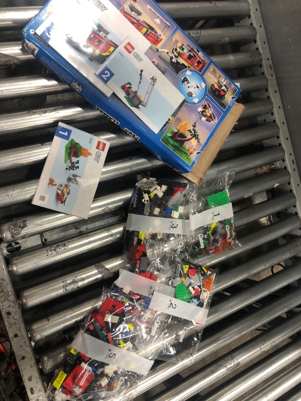 Photo 1 of *UNKNOWN IF MISSING PARTS**LEGO City Fire Command Truck Building Set - Fire Truck Toy with Land & Air Drones for Boys & Girls, Ages 7+ - Kids Pretend Play Toy with 3 Minifigures - Gift Ideas for Birthdays - 60374
