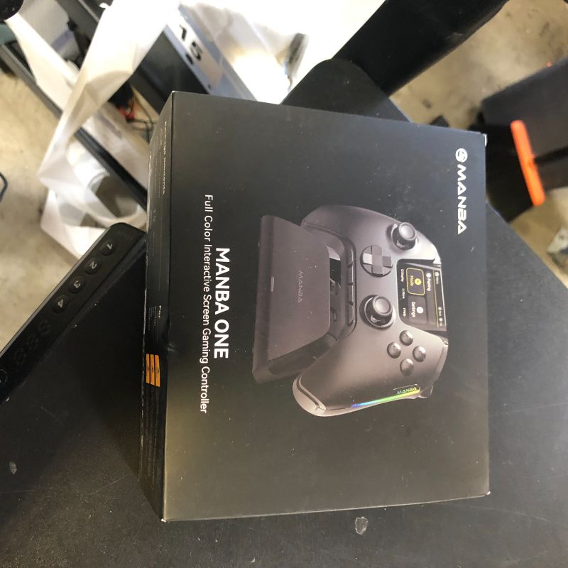 Photo 1 of ManbaOne Interactive Screen Wireless Gaming Controller for PC/Switch/iOS/Android,Hall Effect Stick & Trigger,RGB Lighting,Remappable Buttons,1800mAh with Charging Dock (Black)