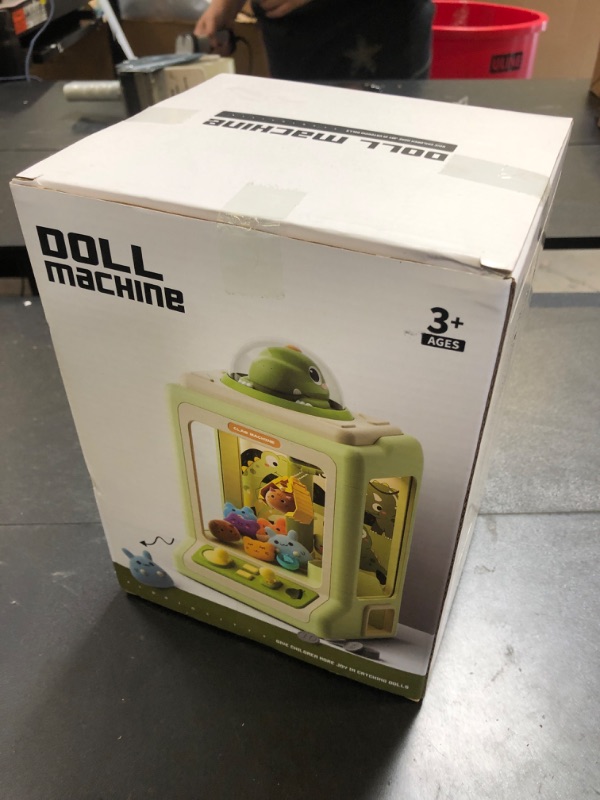 Photo 1 of Claw Machine for Kids, Mini Vending Machine with Game Coins & Music, Prize Dispenser Toys for Girls and Boys, Electronic Claw Game Machine for Party Birthdays, Includes 35 Mini Toys (Doggy Pink)