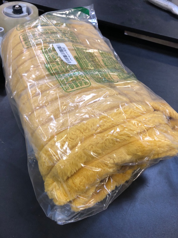 Photo 1 of NEWCOSPLAY Super Soft Throw Blanket Mustard Yellow Premium Silky Flannel Fleece 3D Ribbed Jacquard Lightweight Bed Blanket All Season Use (Mustard Yellow Ribbed, Throw(50"x60"))