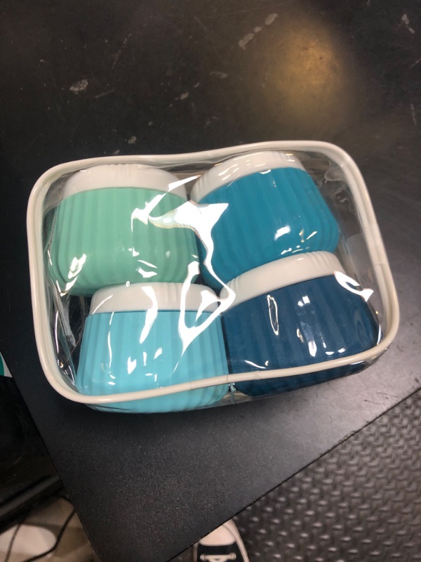 Photo 1 of Mrsdry Travel Containers for Toiletries 4 Pack, TSA Approved Travel Size Toiletries, Travel Size Containers, With Clear Bag Leak Proof Silicone Jars, Travel Essentials Creams Jars Carrying Small Items