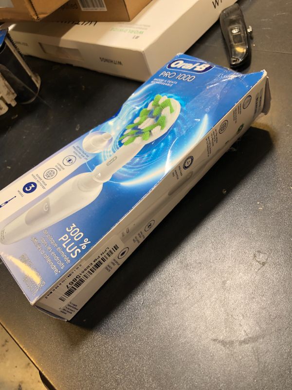 Photo 1 of Oral-B Pro 1000 Rechargeable Electric Toothbrush, White