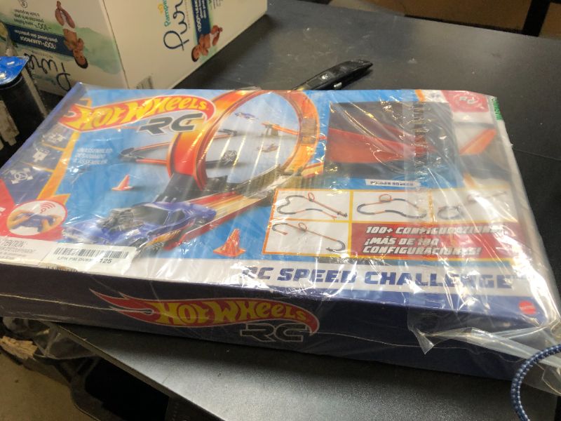 Photo 1 of Hot Wheels Toy Car RC Set with 1:64 Scale Remote-Control Vehicle & 30+ Pieces of Race Track to Create Multiple Configurations