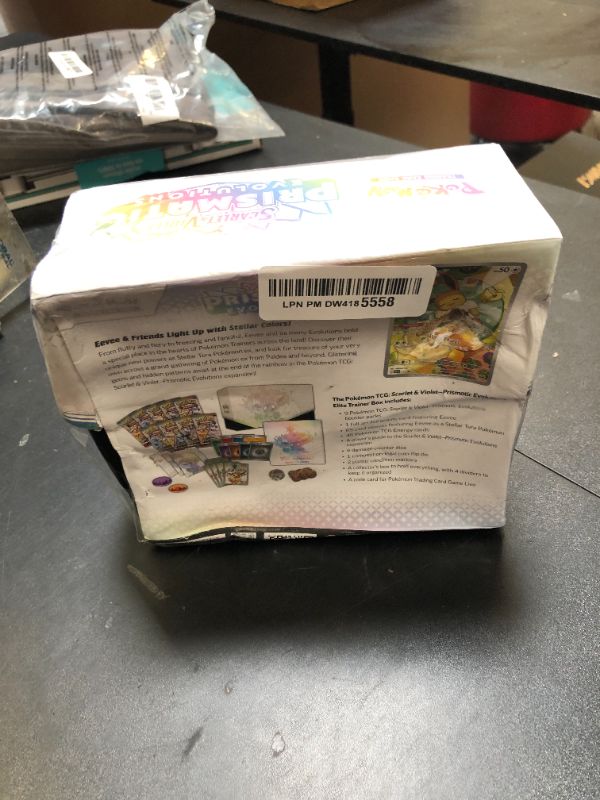 Photo 1 of Pokemon TCG: Scarlet & Violet—Prismatic Evolutions Elite Trainer Box  DAMAGED PKG
