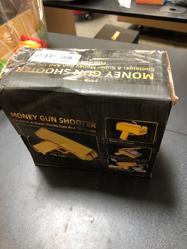 Photo 1 of Gold Money  Shooter and 201 PCS Props (No Real Function) and 5 Style Stickers and 4 AA Batteries, Money Gun That Shoot Money, Make It Rain Money Thrower Gun Handheld Fake Gun Toy Party Supplies