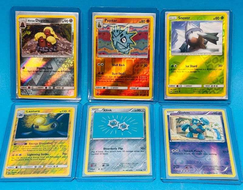 Photo 1 of 025058… 6 Pokémon reverse holo cards in hard plastic sleeves 