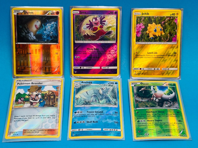 Photo 1 of 025063… 6 Pokémon reverse holo cards in hard plastic sleeves 