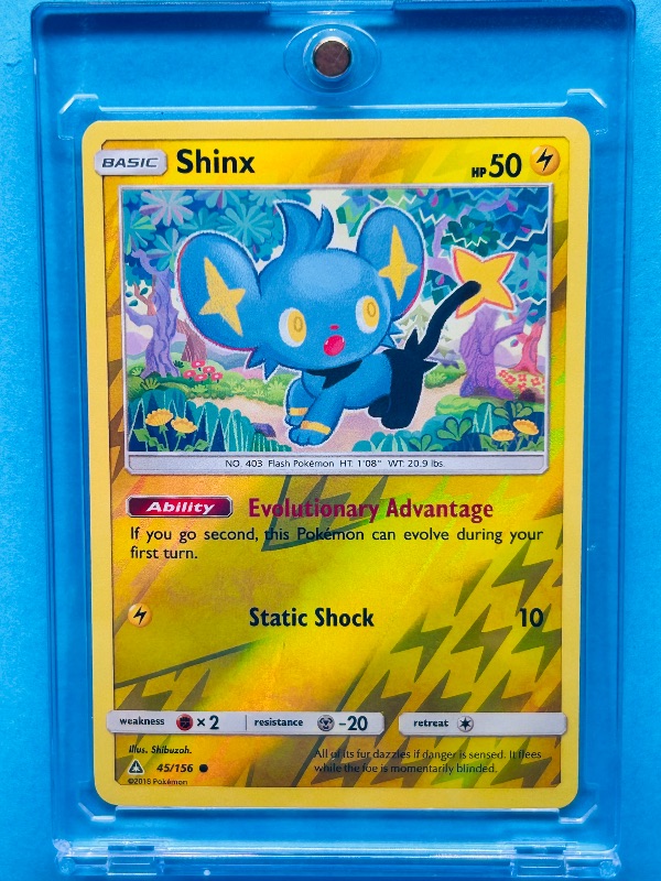 Photo 1 of 025078… Pokémon reverse holo Shinx card in hard plastic case