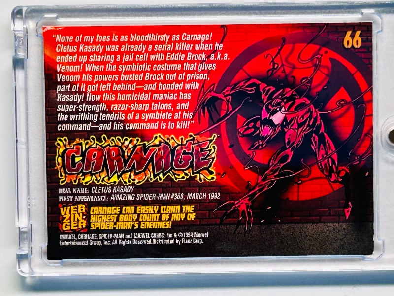 Photo 1 of 025186…1994 Marvel Carnage enemies card 66 in hard plastic case