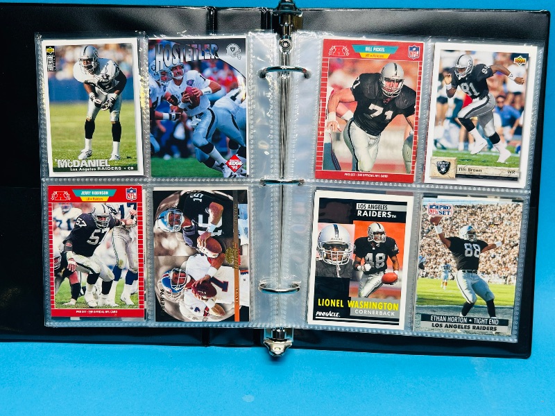 Photo 1 of 025229… final sale no returns/refunds-124 mixed Raiders football cards in binder