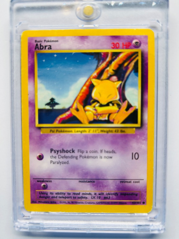 Photo 1 of 025307…Abra Pokémon card  in hard plastic case