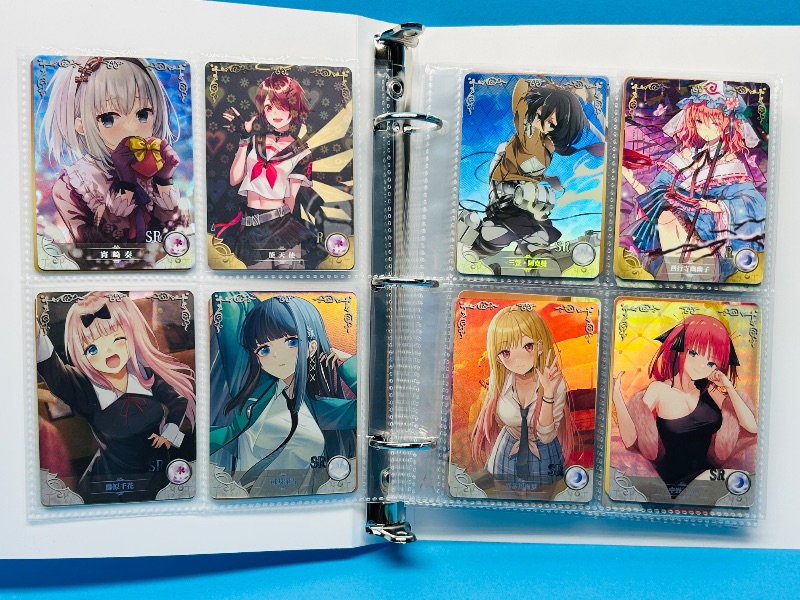 Photo 1 of 025574… final sale no return/refund-80 misc holo asian Anime cards in binder