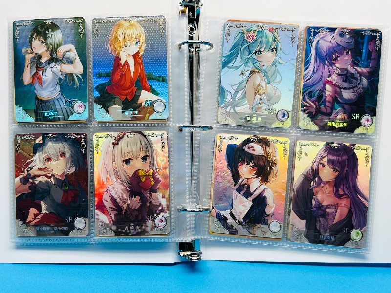 Photo 1 of 025574… final sale no return/refund-80 misc holo asian Anime cards in binder