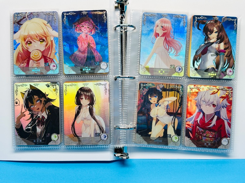 Photo 1 of 025574… final sale no return/refund-80 misc holo asian Anime cards in binder