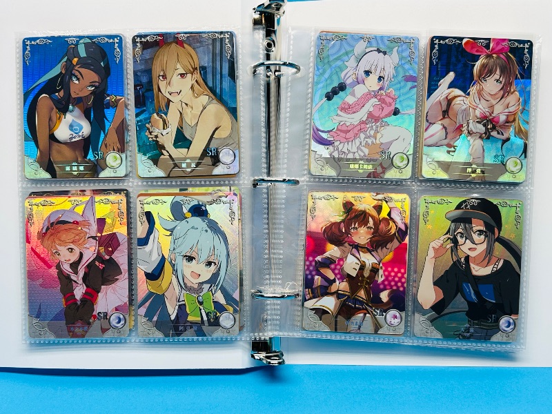 Photo 1 of 025574… final sale no return/refund-80 misc holo asian Anime cards in binder